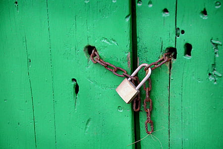 chain with padlock on wood plank thumbnail