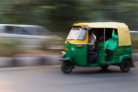 Green and Yellow 3 Wheeled Vehicle thumbnail