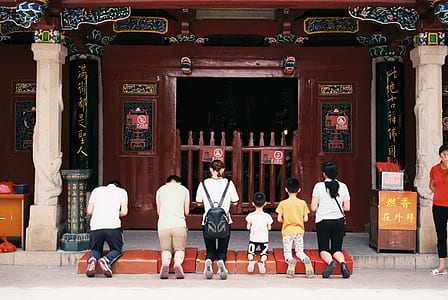 six people kneeling in front of shrine thumbnail