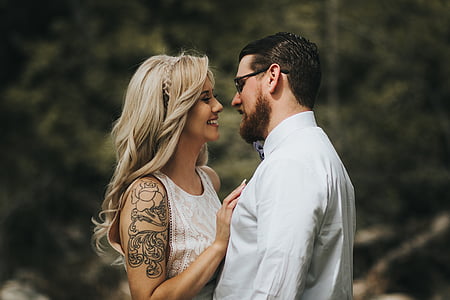 couple facing each other while smiling thumbnail