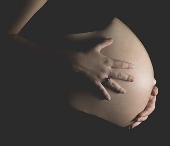 woman holding tummy thumbnail