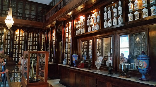 people looking at display glass cabinet thumbnail