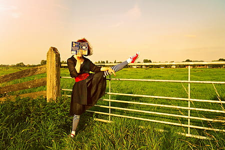 woman wearing black dress reading book thumbnail