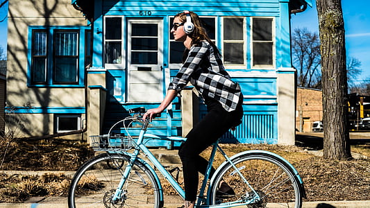 woman riding on teal dutch bicycle while listening thumbnail