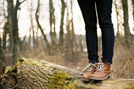 photography of person wearing brown leather work boots during daytime thumbnail