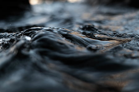 close up photography of black and brown concrete surface thumbnail