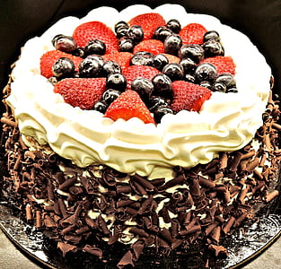 chocolate cake with strawberry and blueberry toppings thumbnail