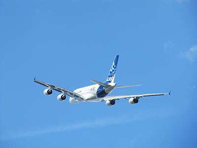 white and blue passenger plane on the sky thumbnail
