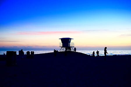 silhouette photo of women near sea thumbnail