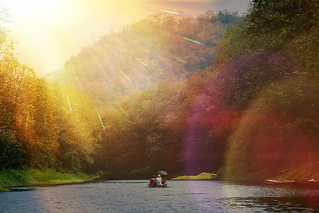 group of people on boat surrounded by body of water thumbnail
