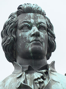 gray concrete statue under white sky thumbnail