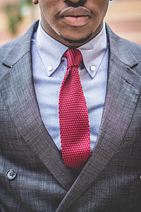 man in grey suit during daytime thumbnail