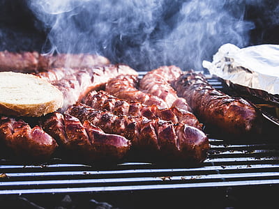 grilled sausages on gray steel grill thumbnail