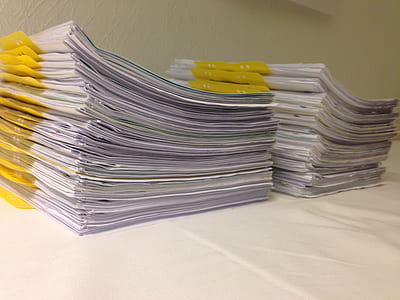 two piles of white printer paper thumbnail