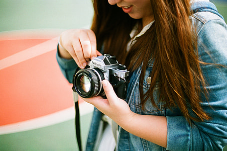 woman holding bridge camera thumbnail