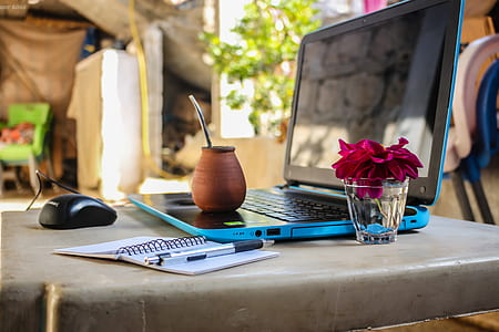 Brown Clay Pot On Black And Blue Laptop thumbnail