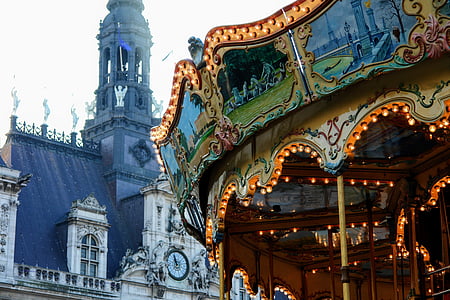 carousel behind white painted baroque building thumbnail
