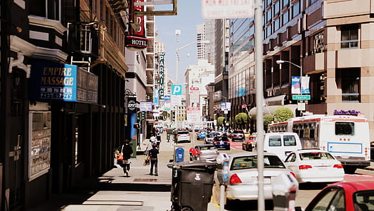 group of people walking and cars on road thumbnail
