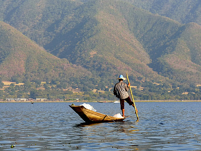 man fishing on body of water thumbnail