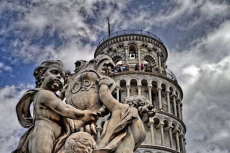 low angle photography of gray concrete tower at daytime thumbnail