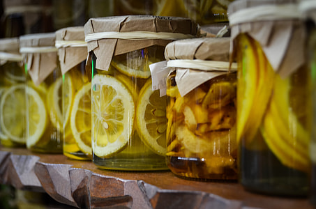 selective focus photography of infused mason jars with brown paper lid thumbnail
