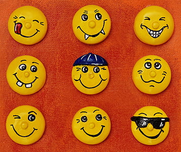 nine emoji ornaments on red surface thumbnail