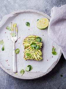flat lay photo of bread with vegetables on plate thumbnail