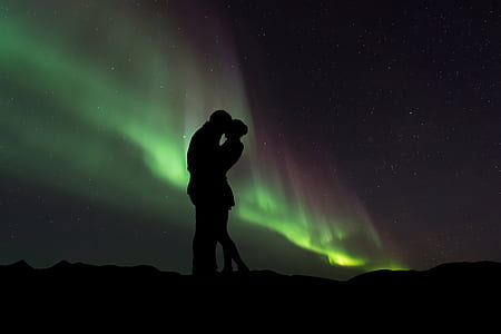 two man and woman kissing on mountain thumbnail