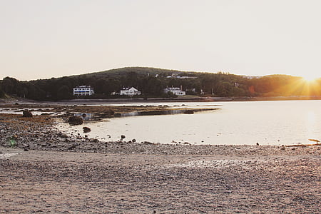 seashore and mountain ranges during daytime thumbnail