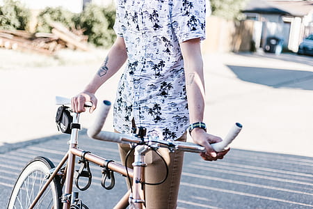 person holding road bike thumbnail