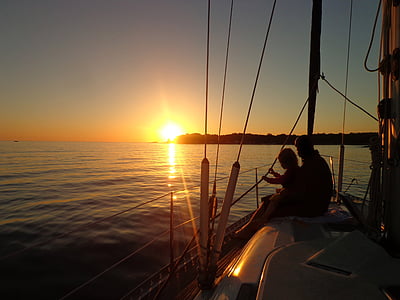 silhouette of person sitting on boat thumbnail