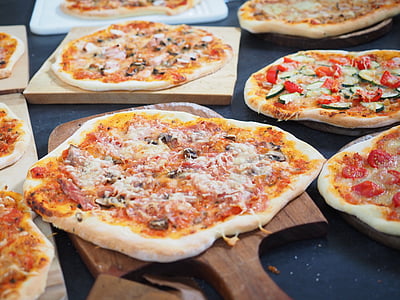 pizza on brown wooden surface thumbnail