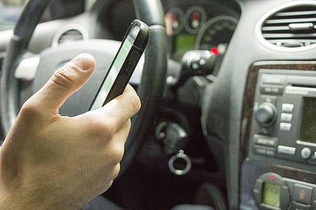 person using smartphone inside car thumbnail