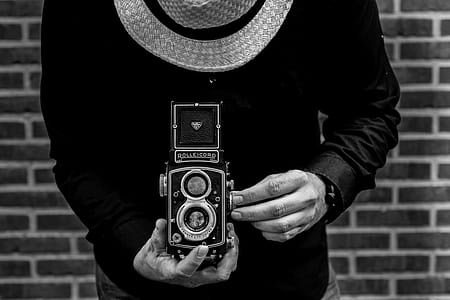 Photo of Person Holding Vintage Camera thumbnail