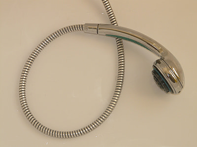 silver shower head on beige surface thumbnail