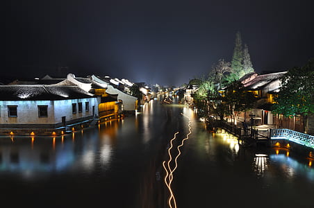 Houses Near a Body of Water during Nigh Time thumbnail