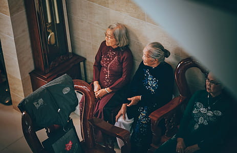 Photography of Three Old Women Sitting on Chair thumbnail