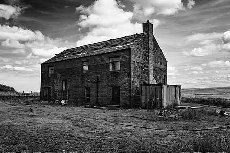 grayscale photography of brick house thumbnail