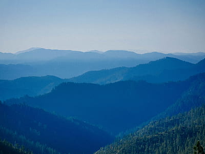 aerial view photography of mountains under clear blue sky during daytime thumbnail