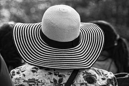 grayscale photo of person wearing sunhat thumbnail