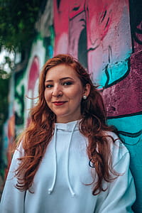 Woman Leaning on Teal and Red Wall thumbnail