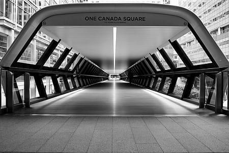 grayscale photo of One Canada Square bridge thumbnail