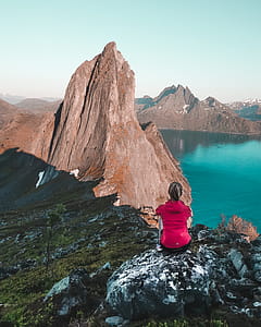 Woman Sitting in Front of Mountain thumbnail