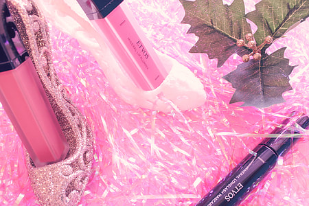 photo of three cosmetic products on pink surface thumbnail