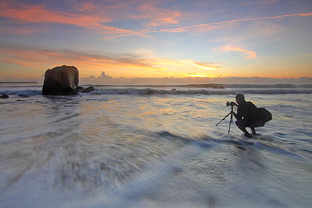 man taking photo of rock thumbnail
