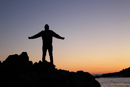 person standing on rock thumbnail
