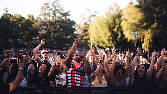 photo of group of people raising their hands thumbnail