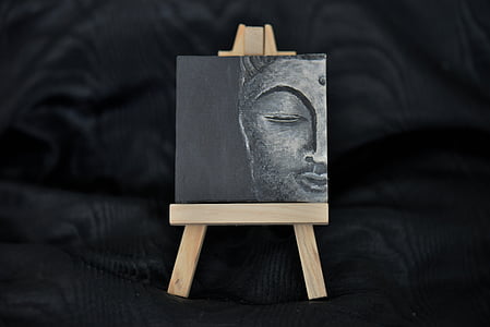 half face Buddha painting in easel thumbnail