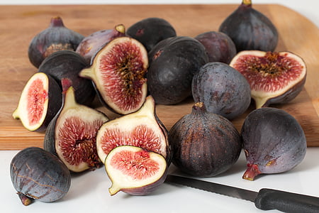 pomegranate fruits on chopping board thumbnail