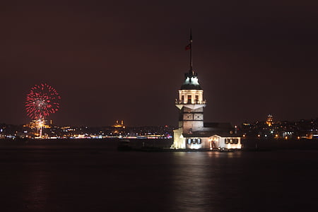 Maiden's Tower, Istanbul, Turkey at night with fireworks at distance thumbnail